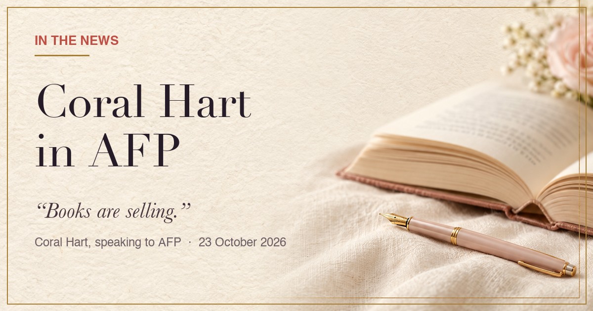 Coral Hart in AFP: a press card on cream paper with a book and a fountain pen